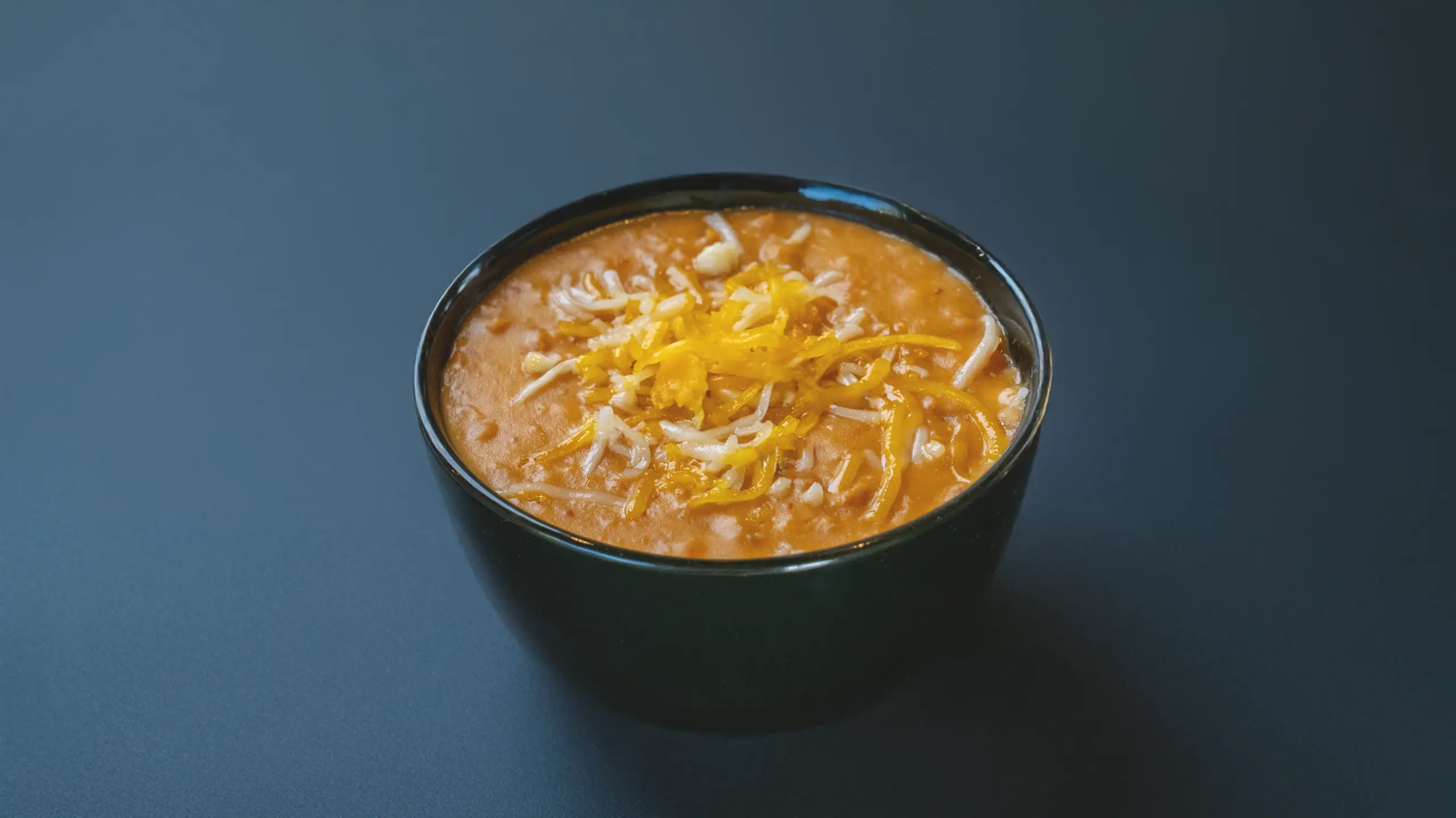 Refried beans topped with cheese