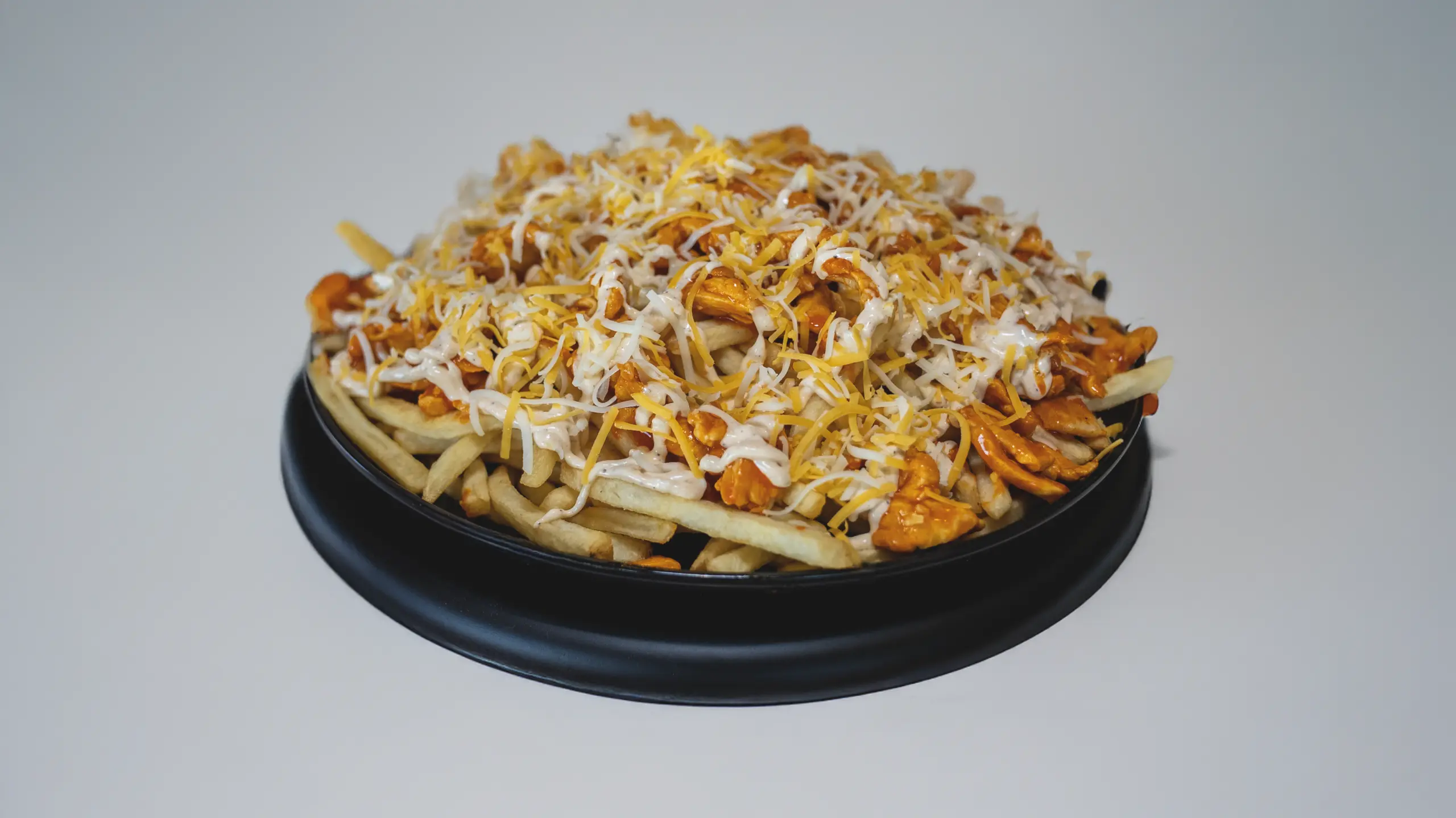 Buffalo Chicken Fries with creamy chipotle sauce and cheese